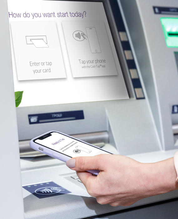 Person tapping smartphone onto Contactless sensor with CashTap displayed on the screen of the phone and on the ATM machine touchscreen